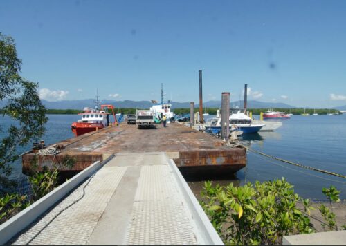 North Wharf marine facility in Cairns with moored vessels, tugboat and barge - North Marine